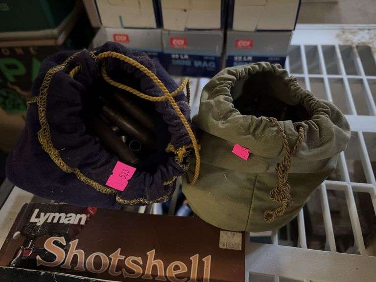 2 bags of ammo shells, reloading handbook and burlap bag image