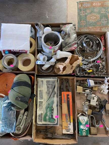 Large lot of six flats containing tape, plumbing supplies, padlocks, calipers, ratchet strap, and tools image