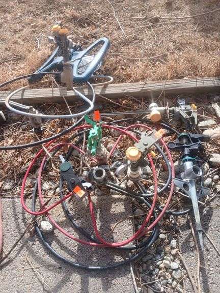 7 sprinkler heads with stands. image