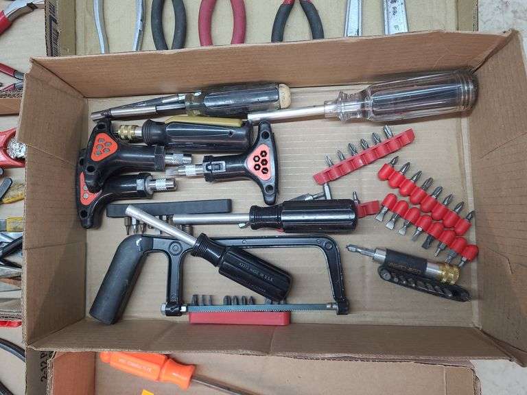 1 craftsman magnetic lighted screw driver,3 screw drivers with bits, 4 bit drivers ,1 hack saw ,7 sets of bits image