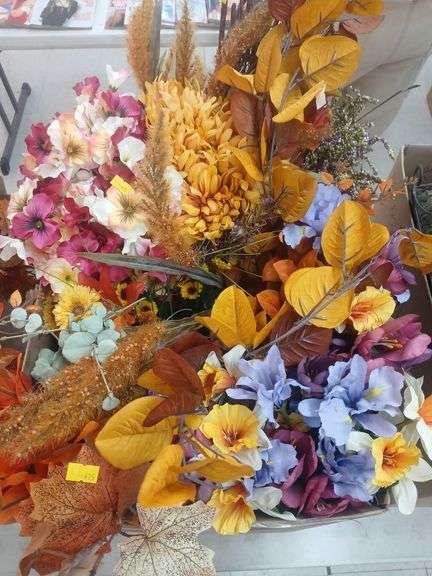 Box of artificial plants. image