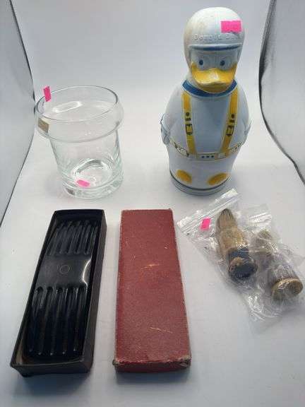 Glass vase, donald duck wheat puffs container, electro static cleaner, shoe polishing brushes image