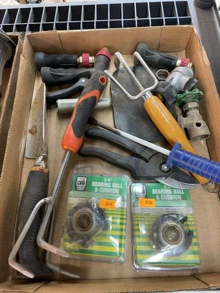 Box of various garden tools and sprayers image