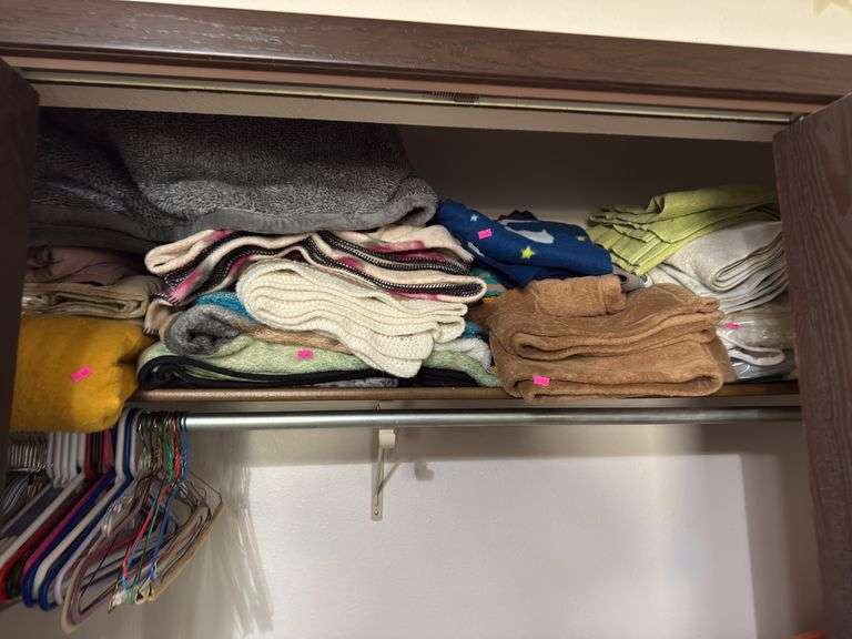 Top closet shelf of blankets  & towels image