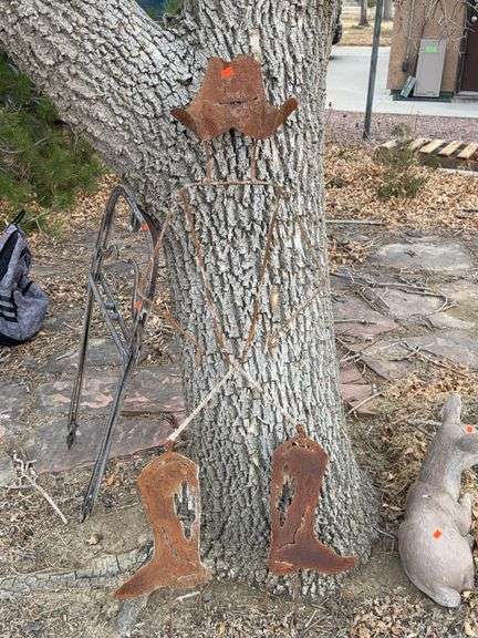 Metal yard art cowboy image