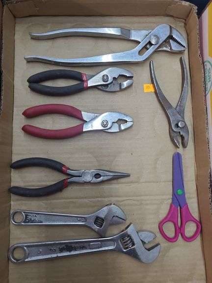 4 pairs of pliers,  1 needle  nose pliers,  1 plastic scissors image