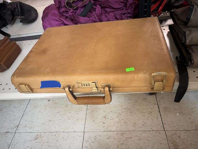 Brief case and Bushnell binoculars image