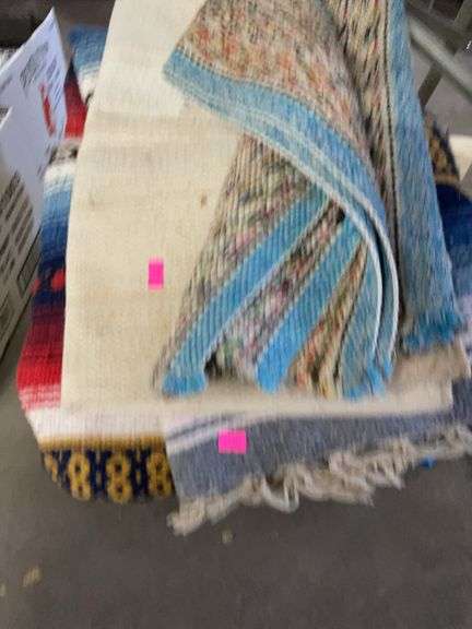 Lot of tarps, blankets, and rugs image