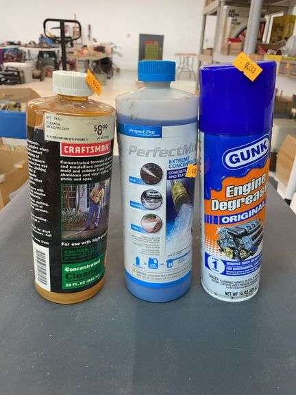 Two bottles of concentrated concrete and tile cleaner, and a can of engine degreaser image