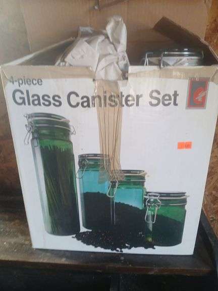 4 peice glass canister set. image