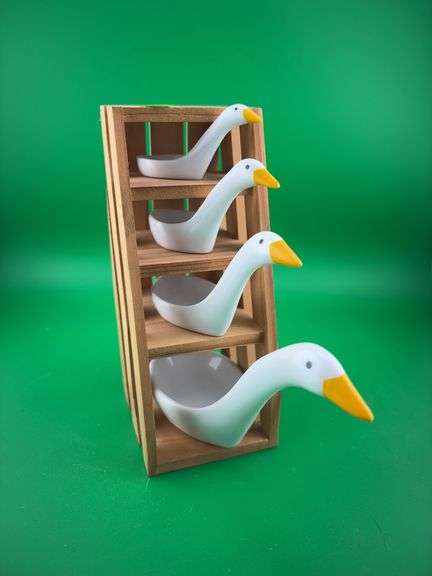 Vintage ceramic geese measuring spoons on a wooden stand and a Park Sherman Mid-Century Modern chrome liquor dispenser set with shot glasses. image