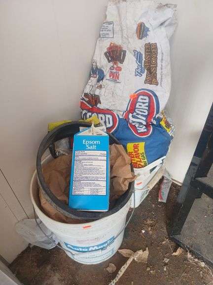 5 gal bucket with bird feed/charcoal. image