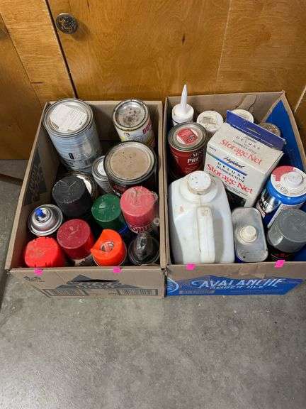 Two boxes of various paints, stains and chemicals ￼ image