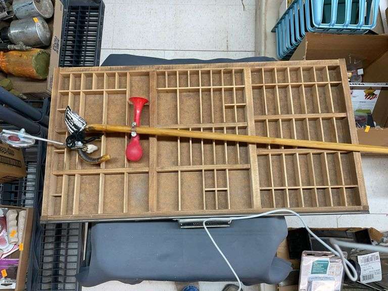 Bamboo cane and small item display shelf. image