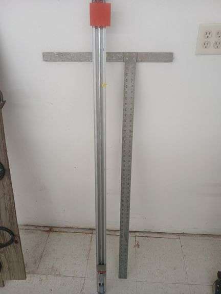 Tablesaw stop and 48inch metal square. image