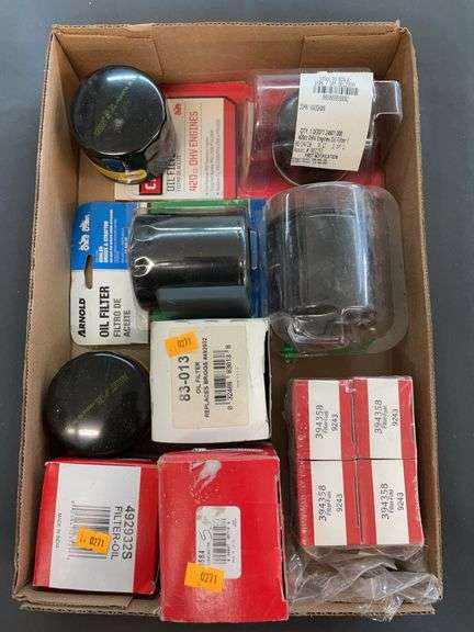 Box of various oil filters, and fuel filters. image