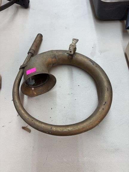 vintage brass car horn and antique Arcade wall-mount coffee grinder image