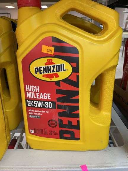1.25 gallon bottle of Pennzoil high mileage SAE 5W-30 engine oil. Approximately 2 quarts left. image