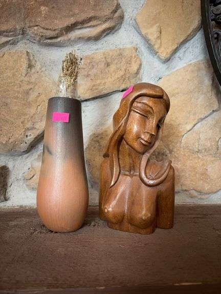 Pottery vase and wood carved nude women image