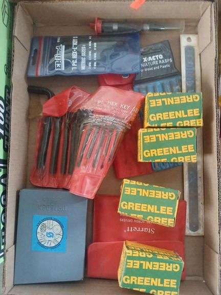 Flats of misc drill bits hex keys. image