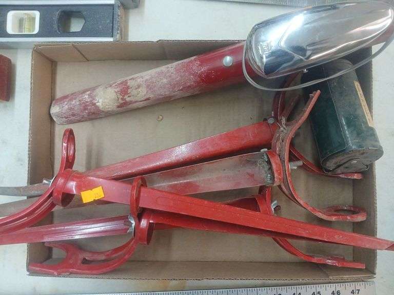 6 fishing pole stands and bait box. image