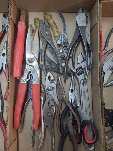1 box of assorted pliers,  needle  nose pliers,  wire cutters,  crescent  wrench,  and scissors image