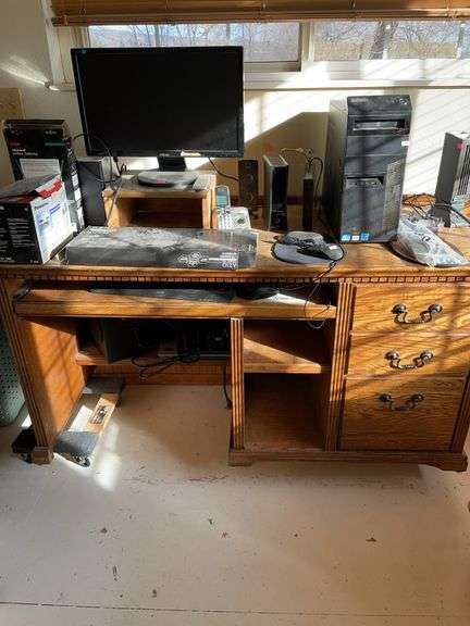 Oak three drawer computer desk. Contents not included. image
