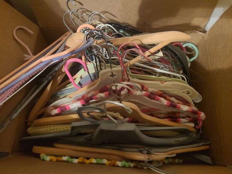 1 box of clothes hangers and 1 polyfoam bed cushion image