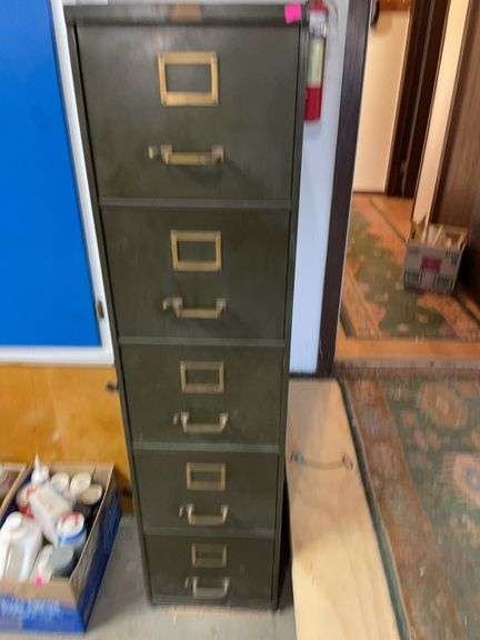 Five drawer metal file cabinet with several hanging file folders image