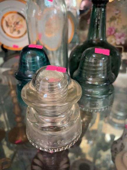 3 glass insulators and 2 glass bottles image