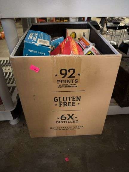 Box of empty 12 gauge boxes and shot gun holes image