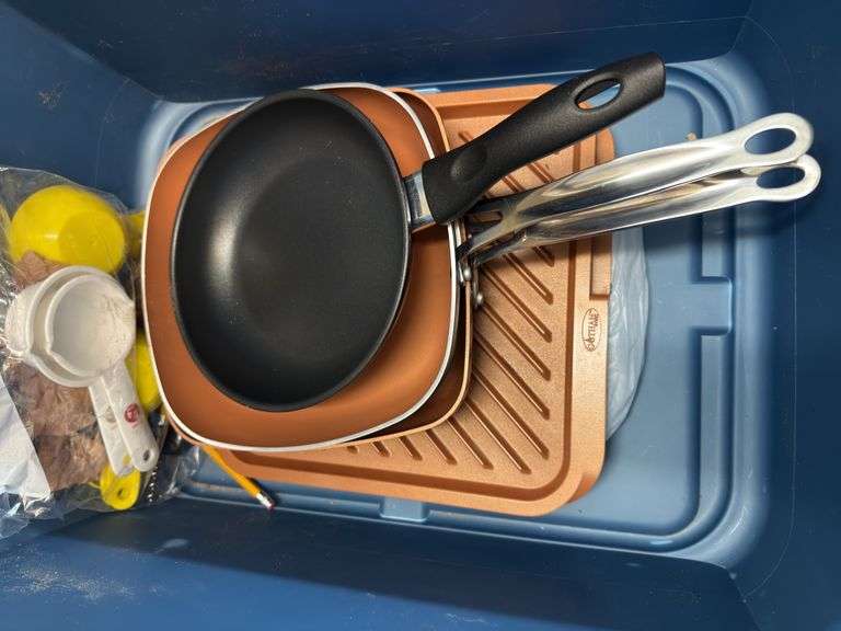 Tub of cooking pans & measuring scoops image