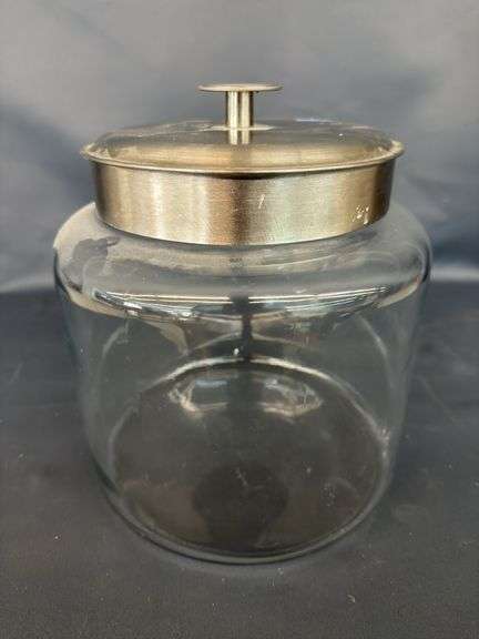 Cosmopolitan glass decorative jar with a metal lid image