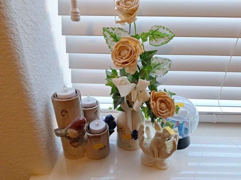 Assorted Home Decor Items: Floral Arrangement, Figurines, and Snow Globe image