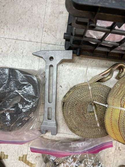 Crate of ratchet straps.