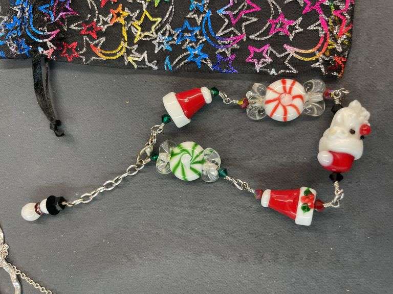 Assorted Christmas jewelry with pouch