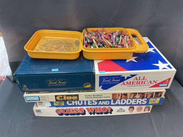 Assorted games and box of crayons