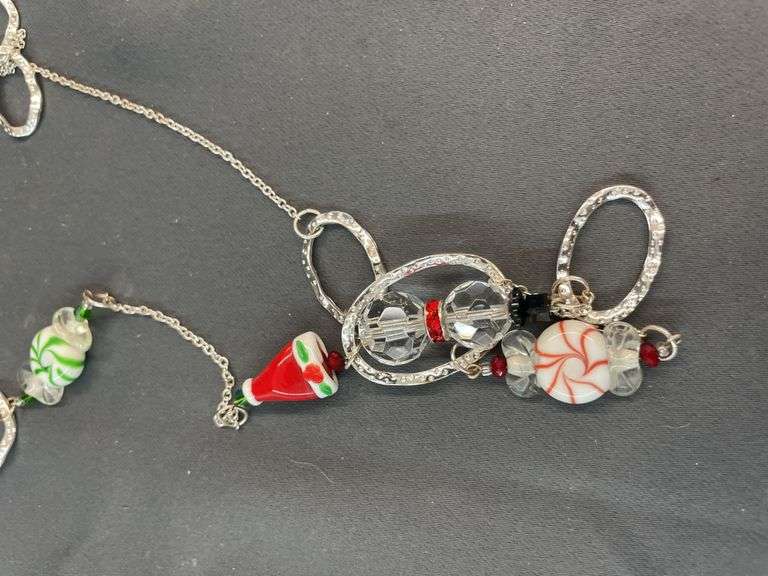 Assorted Christmas jewelry with pouch