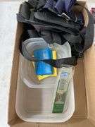 Box of old pictures, straps, coin protectors and plastic containers.