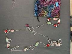 Assorted Christmas jewelry with pouch