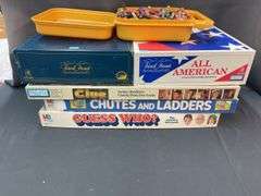Assorted games and box of crayons