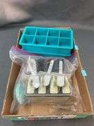 Assorted items: square ice cube trays, popsicle tray,