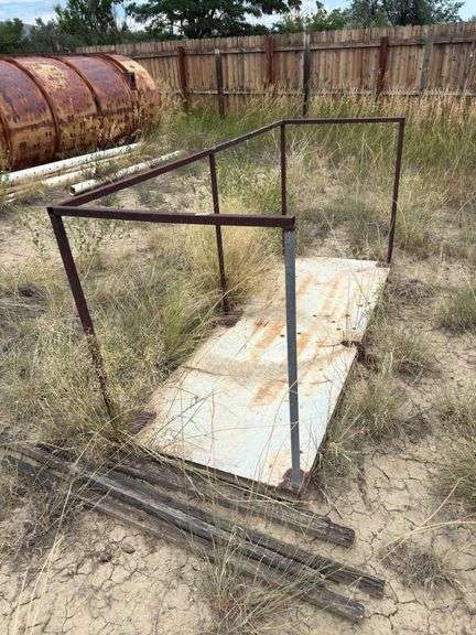 Metal door with steel railing welded to it. image