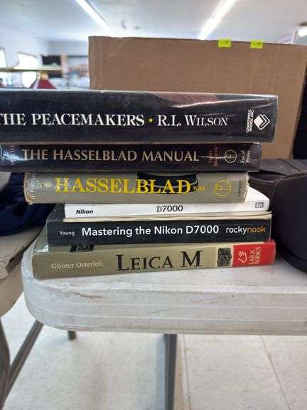 Assorted camera and gun books image