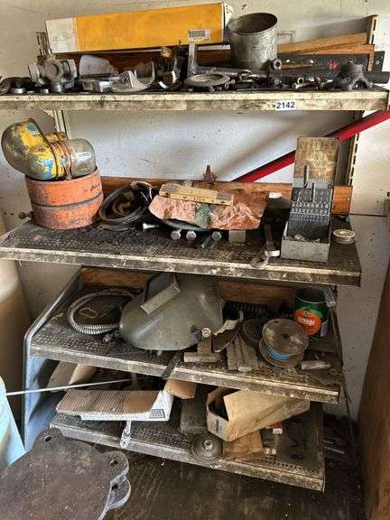 Four shelves of miscellaneous hardware and tools