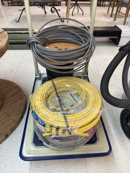 4 rolls of wire and cart image