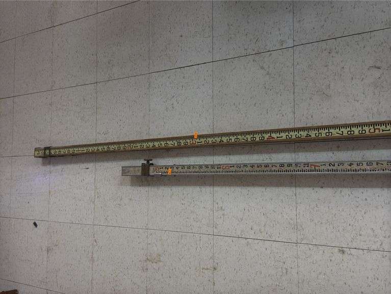Surveying sticks image