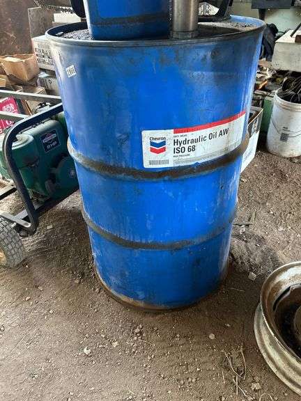 55 gallon drum of hydraulic oil and pump