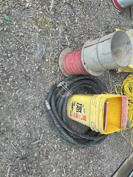 Hydraulic hose, spool of wire, and bucket of miscellaneous