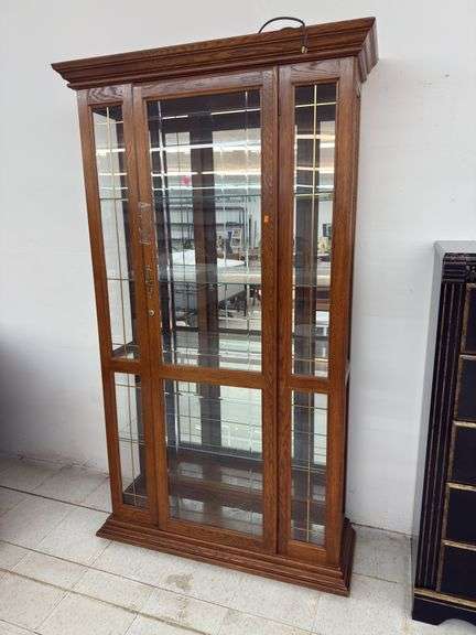 Vintage lighted curio cabinet with keys image